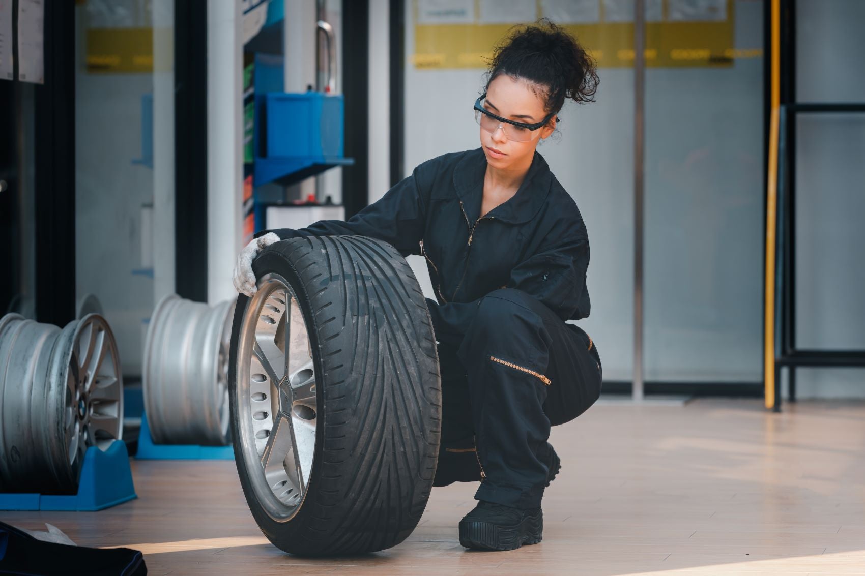 Technician Looking at Alloy Wheel