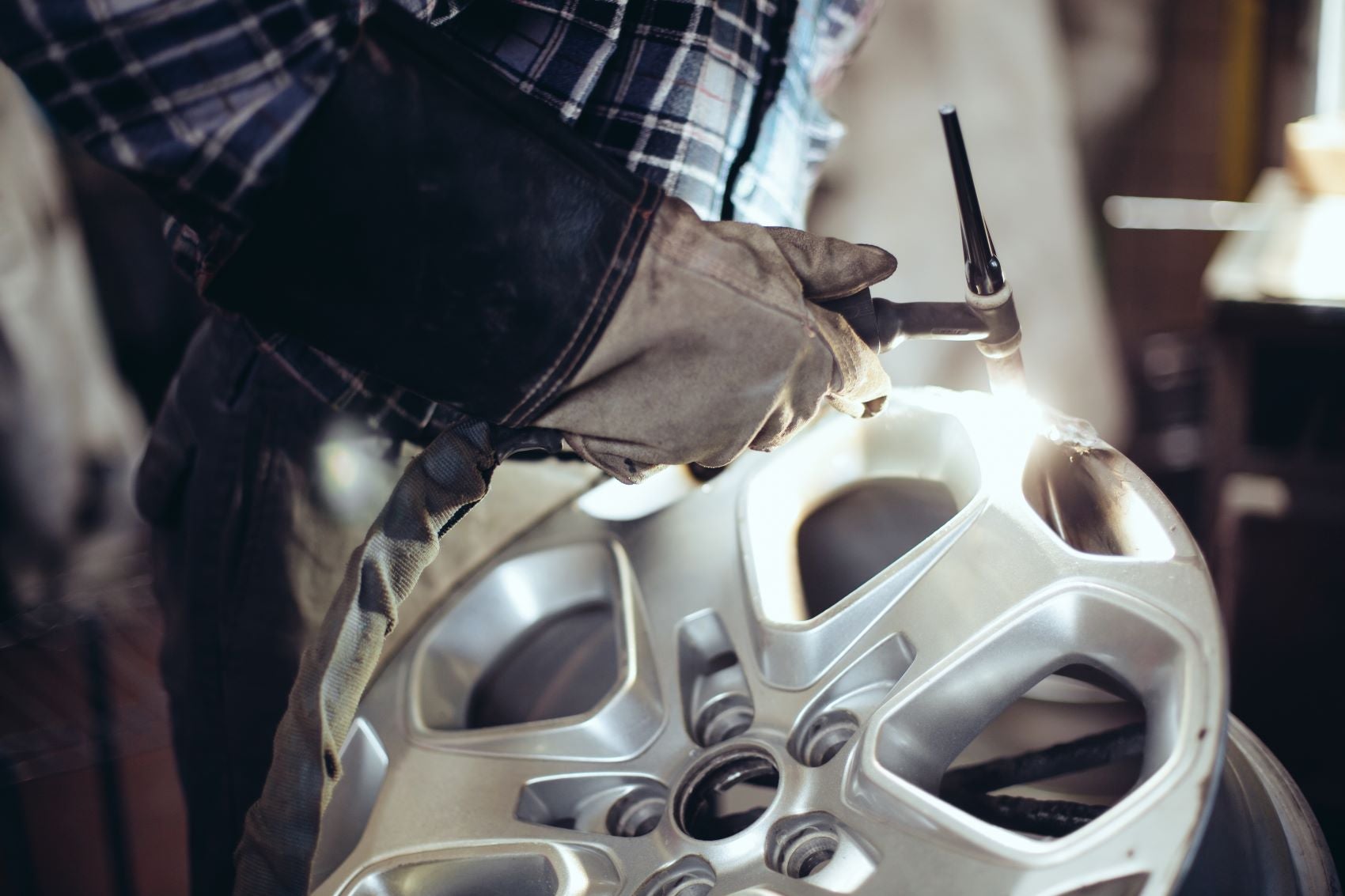 Technician Performing Alloy Wheel Repair